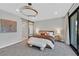 Serene main bedroom featuring a plush bed, natural light, and seamless indoor-outdoor flow at 1404 Reisling Ct, Las Vegas, NV 89144