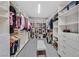 Walk-in closet with custom shelving for clothing, shoes, and accessories at 1404 Reisling Ct, Las Vegas, NV 89144