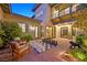 Charming courtyard with outdoor seating and a unique oversized chess set on brick pavers at 1404 Reisling Ct, Las Vegas, NV 89144