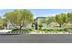 Beautifully landscaped front yard with mature trees and manicured bushes enhances curb appeal at 1404 Reisling Ct, Las Vegas, NV 89144