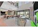 Spacious great room with high ceilings, bar, dining area, and large sliding doors to the backyard at 1404 Reisling Ct, Las Vegas, NV 89144