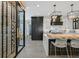 Contemporary kitchen features a large island with seating and a spacious wine cellar at 1404 Reisling Ct, Las Vegas, NV 89144