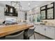 Bright kitchen with a large island, stainless steel appliances, white cabinets, and modern light fixtures at 1404 Reisling Ct, Las Vegas, NV 89144