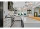 Well-appointed kitchen featuring stainless steel appliances, custom cabinetry, an island and plenty of natural light at 1404 Reisling Ct, Las Vegas, NV 89144