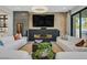 Stylish living room with a modern fireplace and comfortable seating, perfect for relaxation at 1404 Reisling Ct, Las Vegas, NV 89144
