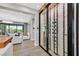 Stylish wine cellar adjacent to the living room featuring climate control and display racks at 1404 Reisling Ct, Las Vegas, NV 89144