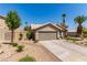Attractive single-story home with a well-maintained yard, desert landscaping, and mature trees at 1761 Summerwood Cir, Henderson, NV 89012