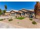 Inviting single-story home featuring desert landscaping, a wide driveway, and neutral tones at 1761 Summerwood Cir, Henderson, NV 89012