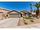 Charming single-story home features desert landscaping and a two-car garage, enhancing its curb appeal at 1761 Summerwood Cir, Henderson, NV 89012