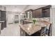 Spacious kitchen features granite countertops, modern appliances, and ample storage, perfect for cooking and entertaining at 1761 Summerwood Cir, Henderson, NV 89012