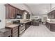 Modern kitchen featuring dark cabinets, stainless steel appliances, and granite countertops at 1761 Summerwood Cir, Henderson, NV 89012