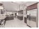 Spacious kitchen with stainless steel appliances, granite countertops, and open layout at 1761 Summerwood Cir, Henderson, NV 89012