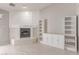 Cozy living room with a fireplace, built-in shelves, and tile flooring at 1761 Summerwood Cir, Henderson, NV 89012