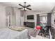 This is a light and airy main bedroom with a ceiling fan, gray walls, and a sliding door to the outside at 1761 Summerwood Cir, Henderson, NV 89012
