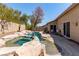 This private pool and spa area has rock features and mature landscaping in a serene backyard at 1761 Summerwood Cir, Henderson, NV 89012