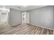 Bedroom with ensuite bathroom and closet with wood-style vinyl flooring at 198 Winterport St, Henderson, NV 89074
