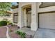 Welcoming entrance with neutral paint, a well-manicured yard, and a front-facing garage at 198 Winterport St, Henderson, NV 89074