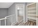 Upstairs hallway with a view into the bedrooms and a storage closet at 198 Winterport St, Henderson, NV 89074