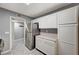 Bright kitchen with stainless steel refrigerator and classic white cabinetry at 198 Winterport St, Henderson, NV 89074