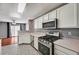 Open kitchen overlooks the living area and includes stainless steel appliances at 198 Winterport St, Henderson, NV 89074