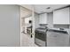 Convenient laundry room with modern washer and dryer units, adjacent to the kitchen at 198 Winterport St, Henderson, NV 89074