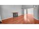 Spacious living room featuring a fireplace, hardwood floors, and neutral paint at 198 Winterport St, Henderson, NV 89074
