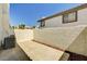 Private patio area with block wall and HVAC unit at 198 Winterport St, Henderson, NV 89074