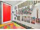 Hallway with colorful floor and walls decorated with artwork and Rubik's cubes at 200 Hoover Ave # 1813, Las Vegas, NV 89101