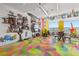 Eclectic living room with art, a colorful epoxy floor, and city view at 200 Hoover Ave # 1813, Las Vegas, NV 89101