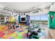 Bright living area with a cityscape view and colorful epoxy floor at 200 Hoover Ave # 1813, Las Vegas, NV 89101