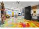 Bright living room with colorful epoxy floor and creative art at 200 Hoover Ave # 1813, Las Vegas, NV 89101