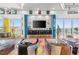 Living room featuring colorful floors, modern furniture, and city skyline views at 200 Hoover Ave # 1813, Las Vegas, NV 89101