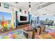 Living room featuring unique colorful epoxy floors and a flat-screen television at 200 Hoover Ave # 1813, Las Vegas, NV 89101