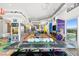 Open living space with kitchen, dining, and colorful epoxy floors at 200 Hoover Ave # 1813, Las Vegas, NV 89101