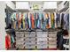 Walk-in closet with a wall to wall hanging rack and storage bins at 200 Hoover Ave # 1813, Las Vegas, NV 89101