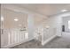 Upstairs hallway displaying views to the lower level and access to a room with black fireplace at 2107 Fountain Springs Dr, Henderson, NV 89074