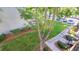View of the backyard showing landscaping, a walkway, and a partial view of parked cars at 2615 W Gary Ave # 2061, Las Vegas, NV 89123