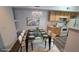 Dining room features a modern table setting, chandelier, and updated flooring at 2615 W Gary Ave # 2061, Las Vegas, NV 89123