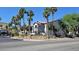 Apartment complex with lush landscaping, palm trees, and a gated entry for added security at 2615 W Gary Ave # 2061, Las Vegas, NV 89123