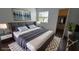 Bedroom featuring a bed, modern side tables, a window, and a closet with hanging clothes at 2615 W Gary Ave # 2061, Las Vegas, NV 89123