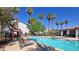 Community pool and lounge area surrounded by trees, offering a peaceful retreat at 2615 W Gary Ave # 2061, Las Vegas, NV 89123
