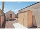 Exterior storage sheds, located in the gravel-covered backyard at 2717 Pastel Ave, Henderson, NV 89074