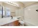 Bathroom features a tub, a toilet, a sink, and a large mirror at 2717 Pastel Ave, Henderson, NV 89074