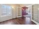 Bedroom featuring hardwood floors with glass doors leading to another bedroom at 2717 Pastel Ave, Henderson, NV 89074