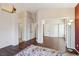 Large bedroom with wood floors leads to bathroom and other bedrooms at 2717 Pastel Ave, Henderson, NV 89074