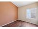 This cozy bedroom has hardwood floors and a sun-filled window at 2717 Pastel Ave, Henderson, NV 89074