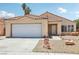 Charming single-story home featuring desert landscaping, a two-car garage and a tile roof at 2717 Pastel Ave, Henderson, NV 89074