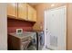 Well-equipped laundry room boasts modern washer and dryer units at 2717 Pastel Ave, Henderson, NV 89074