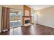 Bright living room featuring a fireplace and a sliding door accessing a covered patio at 2717 Pastel Ave, Henderson, NV 89074