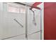 Bright shower with safety bar and hand-held shower head at 2717 Pastel Ave, Henderson, NV 89074